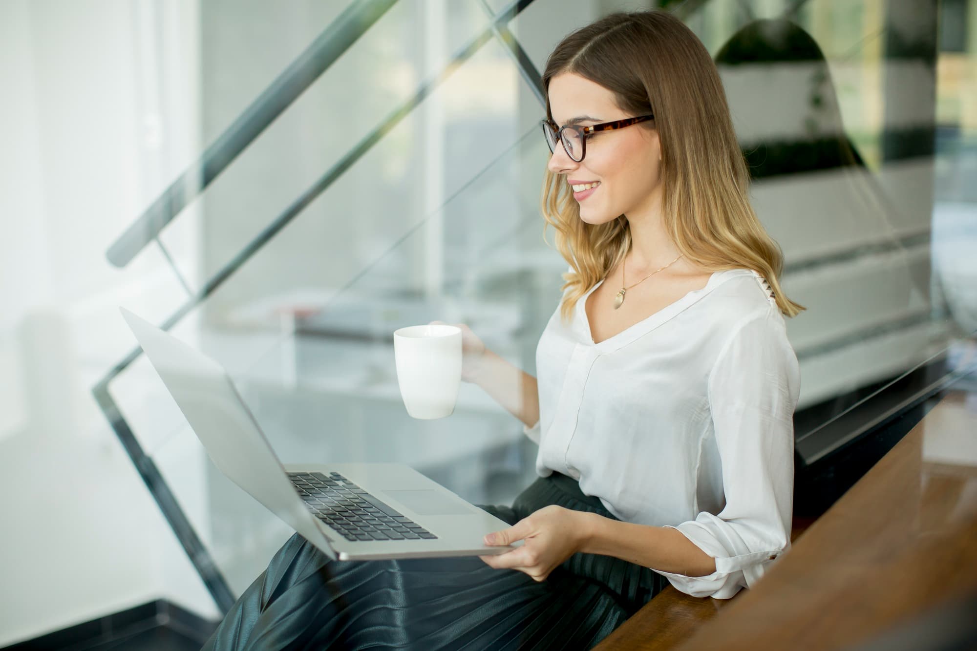 Woman holding laptop